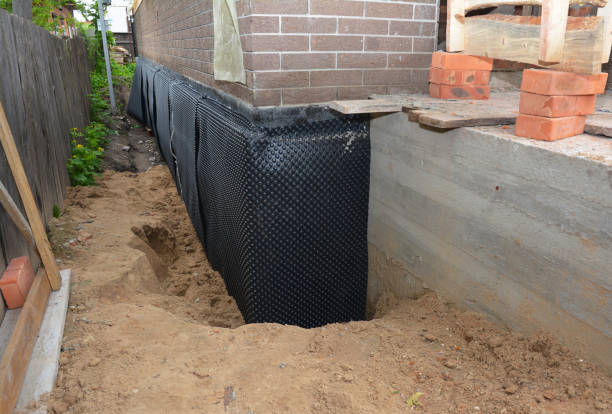 Happy homeowners after waterproofing job in Englishtown